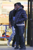 Jermaine Jackson takes a call while out with his boys