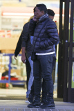 Jermaine Jackson takes a call while out with his boys