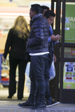 Jermaine Jackson takes a call while out with his boys
