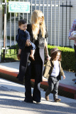 Rachel Zoe and her family attend a birthday party in Brad and Angelina's community