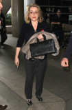 Catherine Deneuve Arriving On A Flight At LAX 