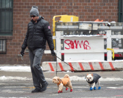 Hugh Jackman bundles for the snow with pups Allegra and Dali
