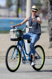 *EXCLUSIVE* Naomi Watts cracks a smile and fist bump as she bikes with the family