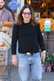 Comical Ozzy Osbourne waves his hands in the air after grocery shopping