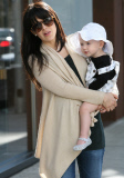 Alec and Hilaria Baldwin take little Carmen on a shopping trip