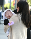 Alec and Hilaria Baldwin take little Carmen on a shopping trip