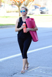 Fitness junkie Reese Witherspoon finishes up a yoga session