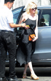 Kirsten Dunst dodges pregnancy rumors as she shows off a hint of belly