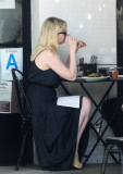 Kirsten Dunst dodges pregnancy rumors as she shows off a hint of belly