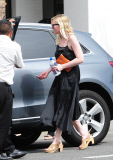 Kirsten Dunst dodges pregnancy rumors as she shows off a hint of belly