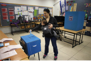 Haifa An Israeli woman casts her ballot at a polling station  in the northern city