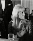Cynthia Lennon Listens To A Speech By Husband John Lennon At The Doorkeeper Hotel.