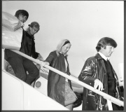 John Lennon His Wife Cynthia Lennon And Fellow Beatle George Harrison Disembark From A Plane As They Return From Their Holiday.