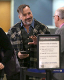 Semi-Exclusive... David Furnish Catches A Flight Out Of LAX 
