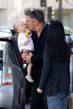 Alec Baldwin plants a big Kiss on baby Carmen
