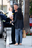 Alec Baldwin plants a big Kiss on baby Carmen