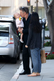 Alec Baldwin plants a big Kiss on baby Carmen