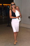 Rosamund Pike all smiles carrying baby Atom through LAX **NO UK**