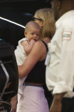 Rosamund Pike all smiles carrying baby Atom through LAX **NO UK**