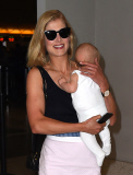 Rosamund Pike all smiles carrying baby Atom through LAX **NO UK**