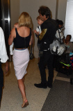 Rosamund Pike all smiles carrying baby Atom through LAX **NO UK**