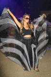 Paris Hilton dances around Coachella holding up her skirt like wings