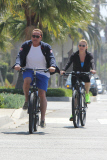 Arnold Scharzenegger goes for a bike ride with his girlfriend in sunny Santa Monica