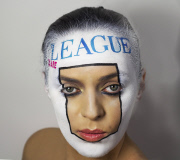 Woman paints album covers on face, London, Britain - April 2015