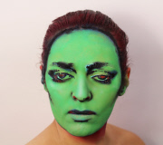 Woman paints album covers on face, London, Britain - April 2015