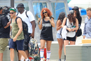 Wild-haired Rihanna hitches a ride on a deep sea fishing boat