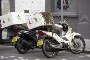Bees swarm on a pizza delivery motorcycle, Fulham, London, Britain - 07 May 2015
