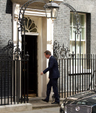David Cameron 
arrives back at Downing Street after meetings at The House of Commons