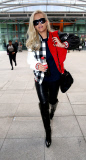 RITA ORA ARRIVES AT LONDON'S HEATHROW AIRPORT
