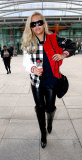 RITA ORA ARRIVES AT LONDON'S HEATHROW AIRPORT