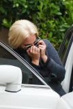 Lady Gaga covers up after a cosmetic laser treatment appointment