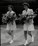 Doris Hart With Unnamed Fellow Tennis Player Both With Flowers- No Date Given.