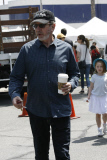 A hungry Tim Allen grabs a bite to eat with his family at Farmers Market