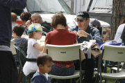 A hungry Tim Allen grabs a bite to eat with his family at Farmers Market