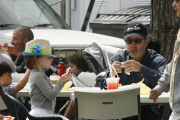 A hungry Tim Allen grabs a bite to eat with his family at Farmers Market