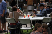 A hungry Tim Allen grabs a bite to eat with his family at Farmers Market