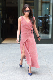 Victoria Beckham is looking stylish in a wrapped sweater dress