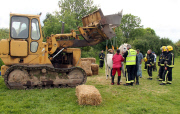 Firefighters use digger to help lift horse that can't stand, Chingford, London, Britain - 30 May 2015