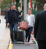 FAMEFLYNET - Wayne And Coleen Rooney Look Very Happy As They Arrive Back In Cheshire From Friends Wedding