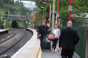 FAMEFLYNET - Wayne And Coleen Rooney Look Very Happy As They Arrive Back In Cheshire From Friends Wedding
