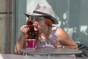 Phoebe Price shows off her derriere in fishnet pants and a thong
