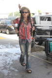 Steven Tyler brings his usual flamboyant style to LAX Airport
