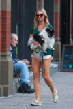 Katrina Bowden takes her dog for a walk in West Village