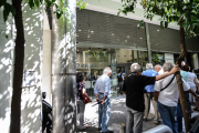 Pensioners at the branch of Attica Bank in Omirou Street