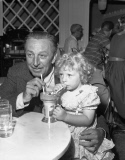 Walt Disney Sharing Ice Cream Soda with Little Girl