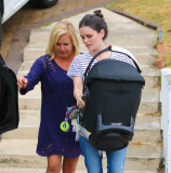 Rachel Bilson carries daughter Briar Rose to the car after a birthday party